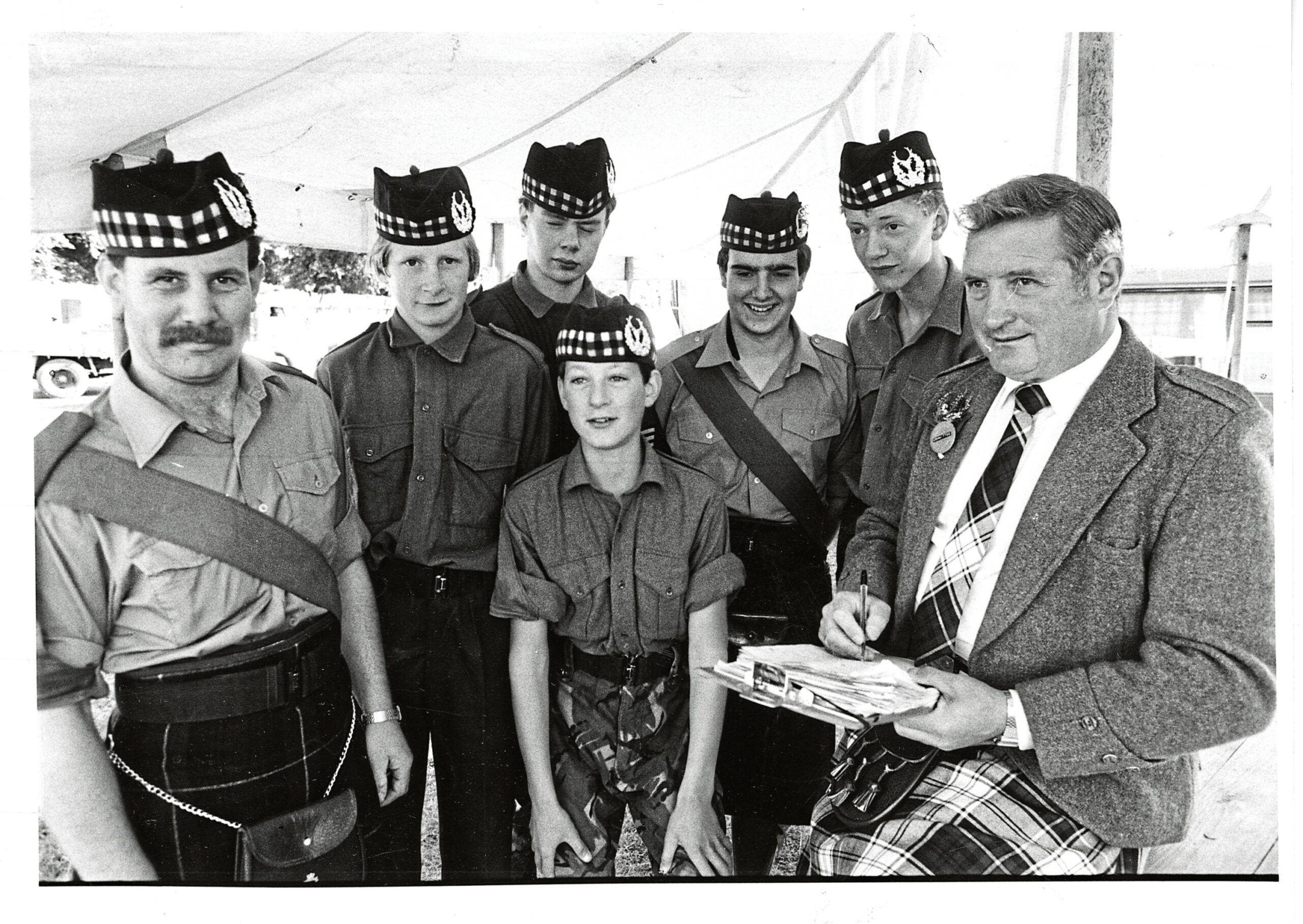 Captain Bill Gardner of Aboyne Platoon, Gordon Highlanders AFC, and Sergeant Gordon Ewen instructing five young cadets in their games duties in 1985.