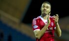 Emotional Aberdeen defender Michael Hector applauds the travelling fans at full-time in his final game for the club. Image: SNS