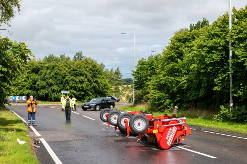 Farming equipment littered across A96 near Lhanbryde after the crash.