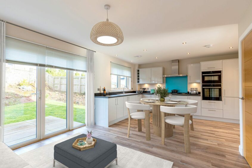 An open plan kitchen with direct garden access.