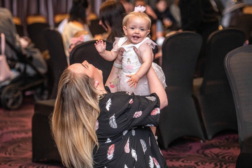Mum plays with her daughter at the Baby Show at Peterhead Scottish Week.