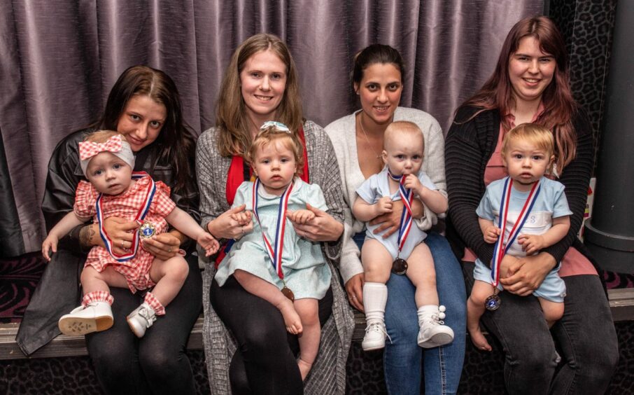Four mothers with their babies who won medals at the Baby Show at Peterhead Scottish Week 2023.