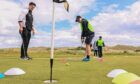 Youngsters golfing at Trump International Links