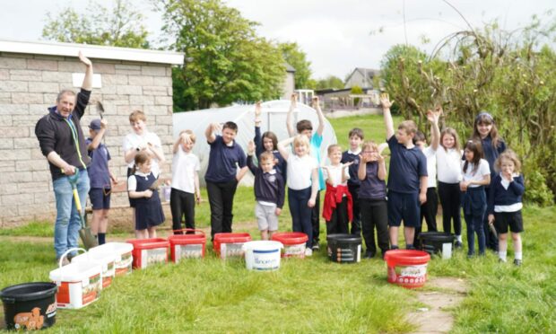 The Monquhitter Primary School pupils learned about growing potatoes with former Turriff Show president Graeme Mackie.