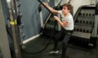 Filip Cegar doing exercises in a gym.