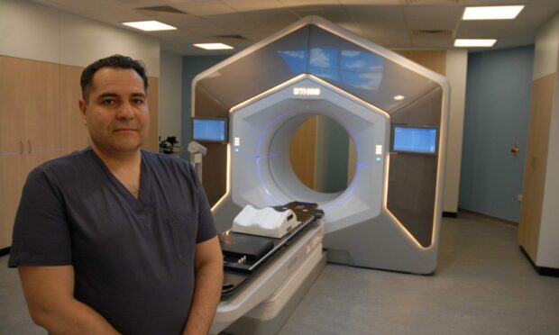 Clinical oncology consultant, Rafael Moleron with one of the new adaptive radiotherapy machines at ARI