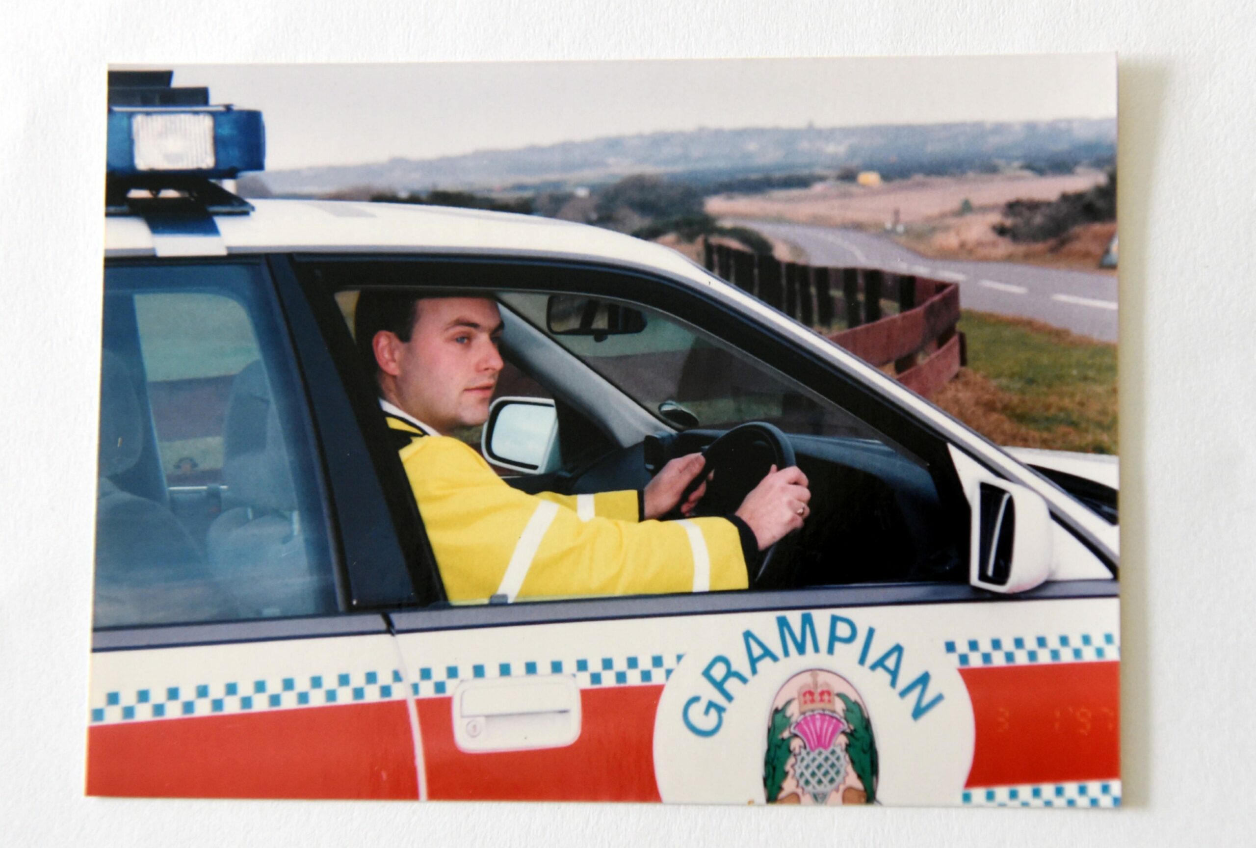 Ch Insp Kevin Wallace in his police car