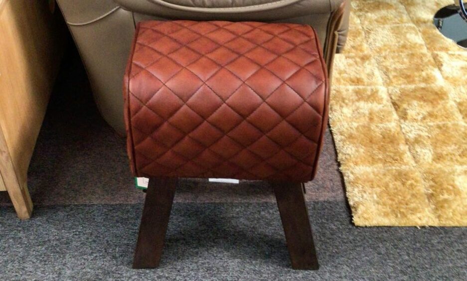 Traditional foot stool in brown leather