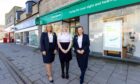 Staff stand outside the new store in Fraserburgh.