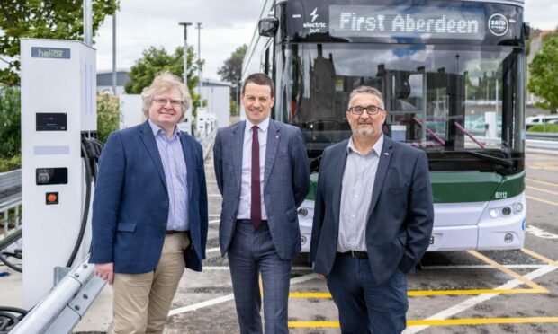 Aberdeen City Council co-leaders Ian Yuill. left, and Christian Allard, right, with First-Bus-Scotland managing director Duncan Cameron in front of one of the new buses.