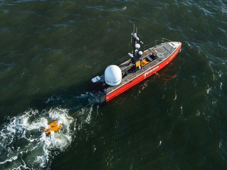 Fugro's robot vessel Blue Essence towing a ROV. 