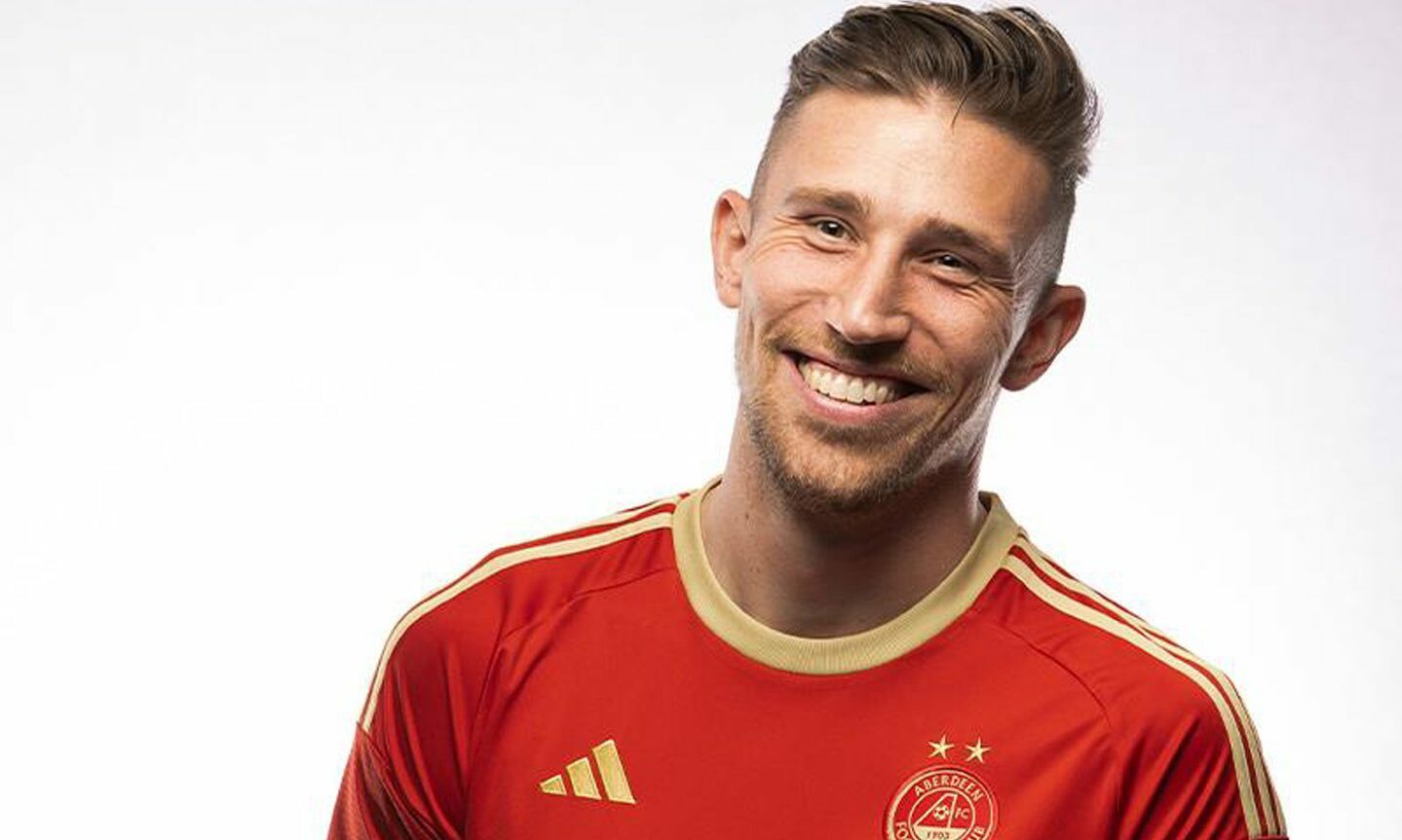 Angus MacDonald in Aberdeen's new home kit for the 2023/24 season.