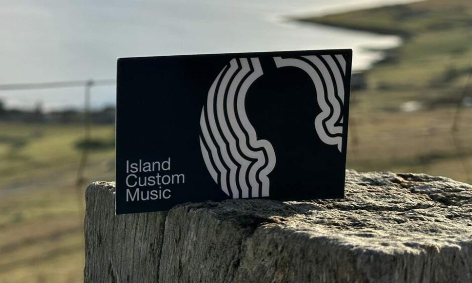 Island Custom Music's business card.