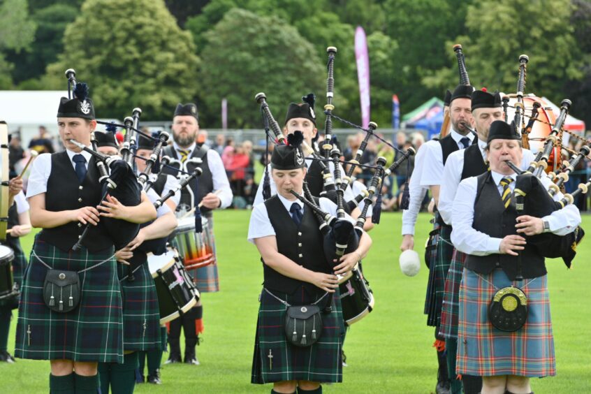 Pipe bands playing at the Inverness Highland Games.