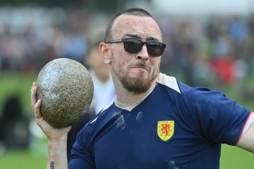 Competitor taking part in the stone put.