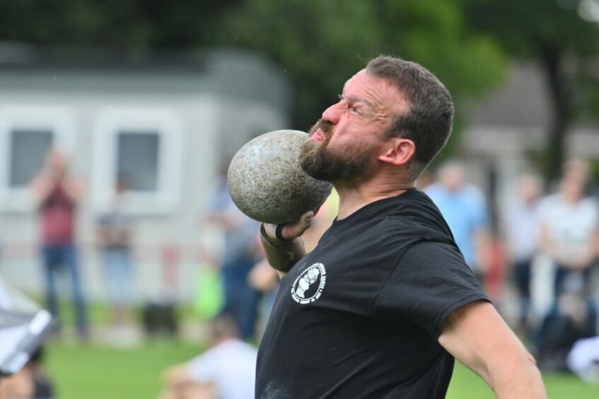 Greg Walker giving it his all for the stone put.