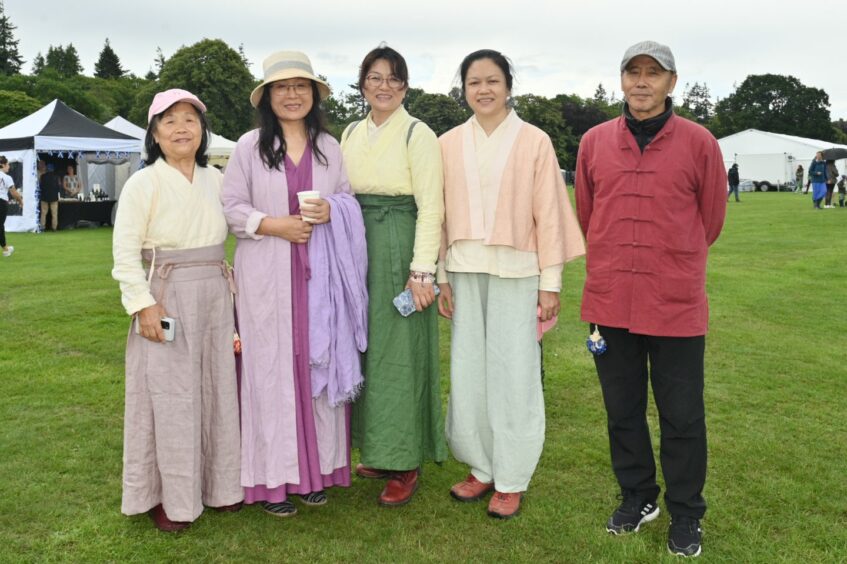 Chinese family at the event in traditional clothing.