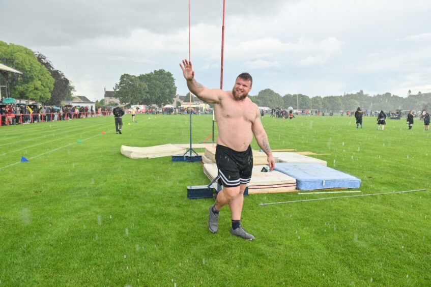 Tom Stoltman waving at fans at the Inverness Highland Games 2023.