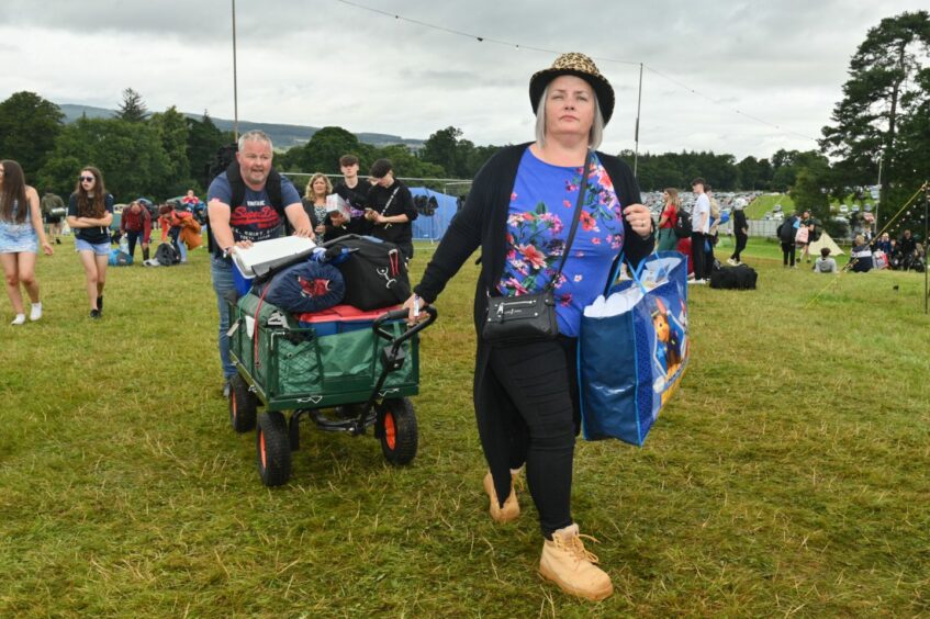 Revellers arriving with camping equipment to Belladrum 2023 on Thursday.