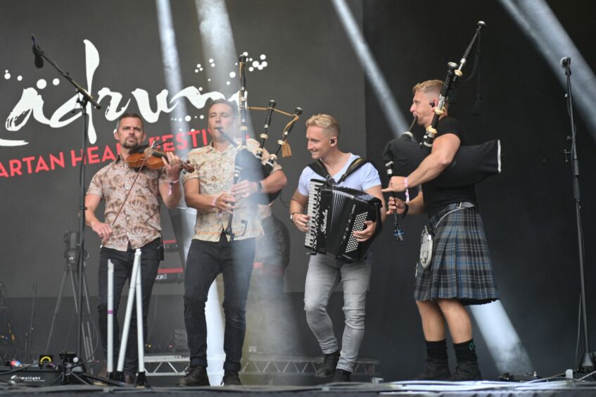 Four members of Skerryvore performing on the opening night of Belladrum 2023