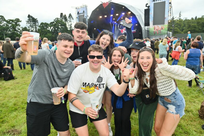 Group of friends at the main stage at Belladrum.