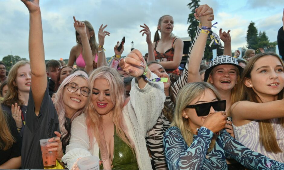 The crowd enjoy Sam Ryder perform.