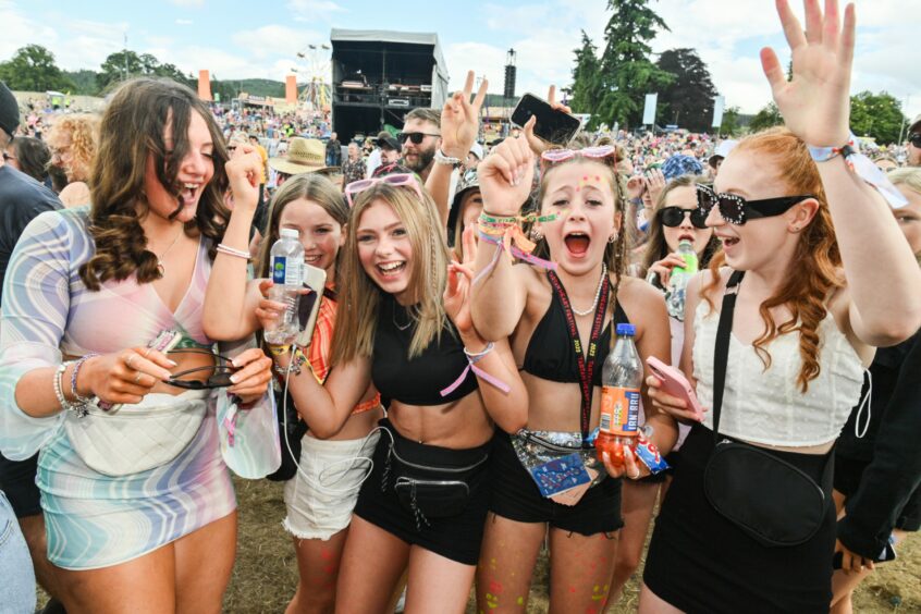 Young group of friends cheer at Belladrum on Saturday.