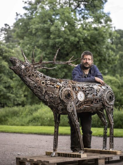 Finnish artist Juha Saraste created the life-size red deer stag using scrap metal in the form of old tools, engine parts and metal objects.