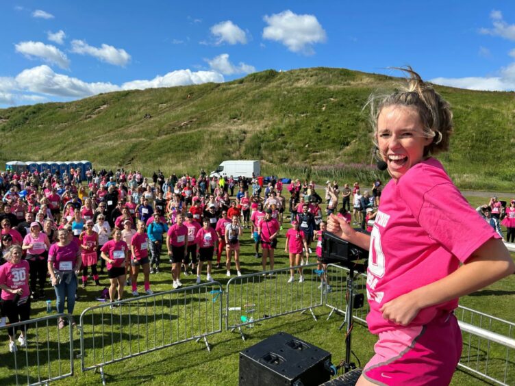 Race for Life participants warming up outdoors.