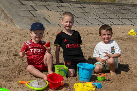 Arlo Skene, 2, Zac Skene, 5, Reni Bryden, 2 building sand castles this morning!  Image: Kenny Elrick/DC Thomson