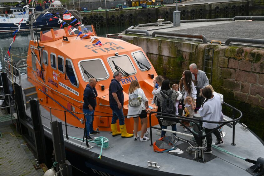 Families tour the RNLI lifeboat.