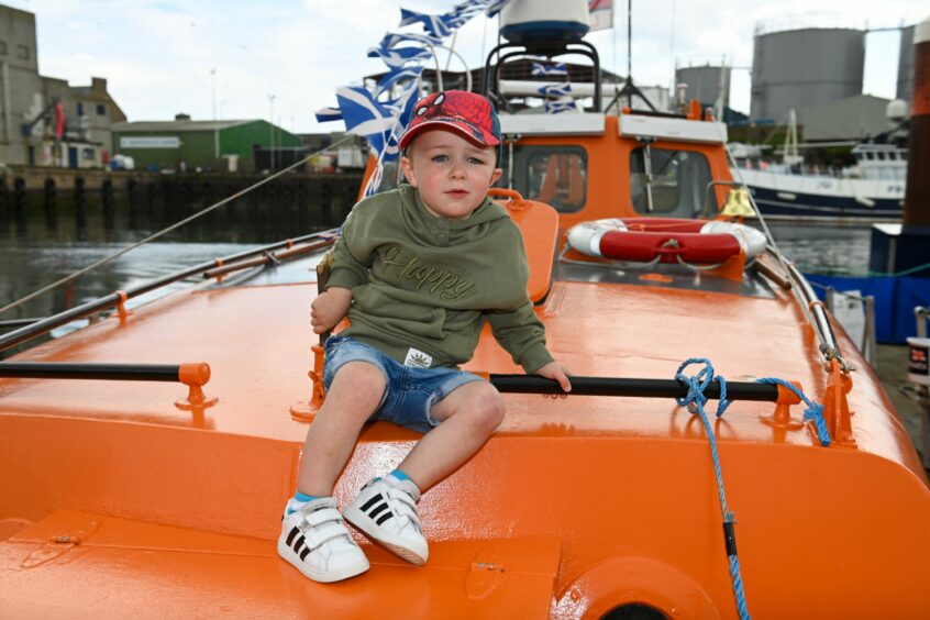 Young boy on the lifeboat.