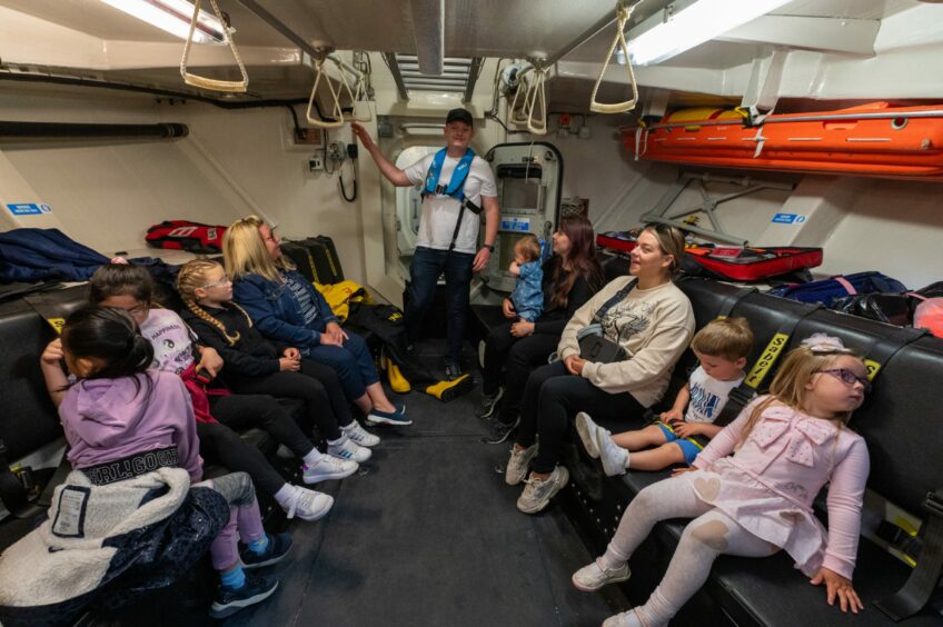 Families inside the lifeboat.