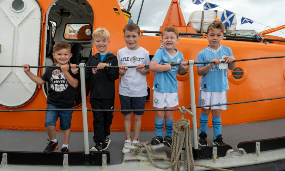 Five young boys at Peterhead's lifeboat station open day.