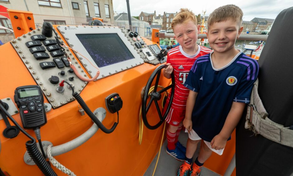 CR0043961, Shanay Taylor, Peterhead. Scottish Week - The RNLI lifeboat open day in Peterhead. Picture of (L-R) Jaiden John Whyte, 10, and Evan Patience, 10. Tuesday, July 18th, 2023, Image: Kenny Elrick/DC Thomson