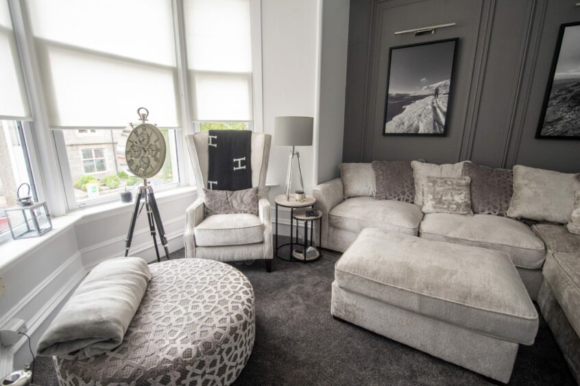 Living room with modern monochromatic decor in the renovated period property in Aberdeen.