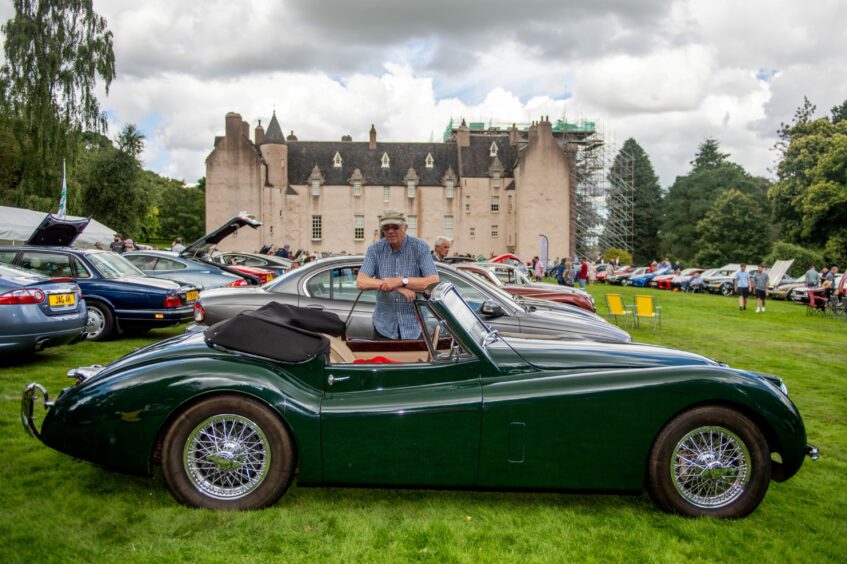 Man with his 1953 XK120 Drophead.