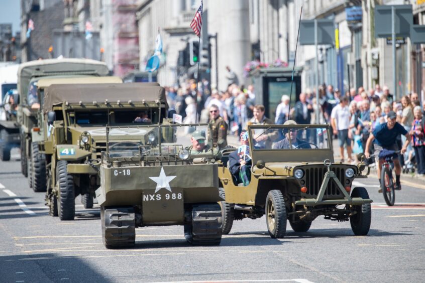 Vintage military vehicles drove in convey as part of the parade. 
