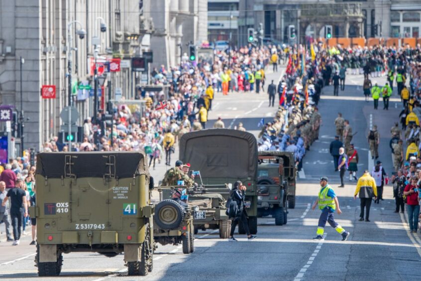 Military vehicles pictured making their way down Union Street during the parade.