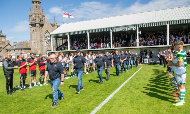 Fraserburgh and Celtic give the RNLI a guard of honour ahead of their friendly at Bellslea. Pictures by Kami Thomson