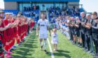 Cove Rangers midfielder Connor Scully and his daughter received a guard of honour ahead of his testimonial against Fraserburgh. Images: Kami Thomson/DC Thomson.