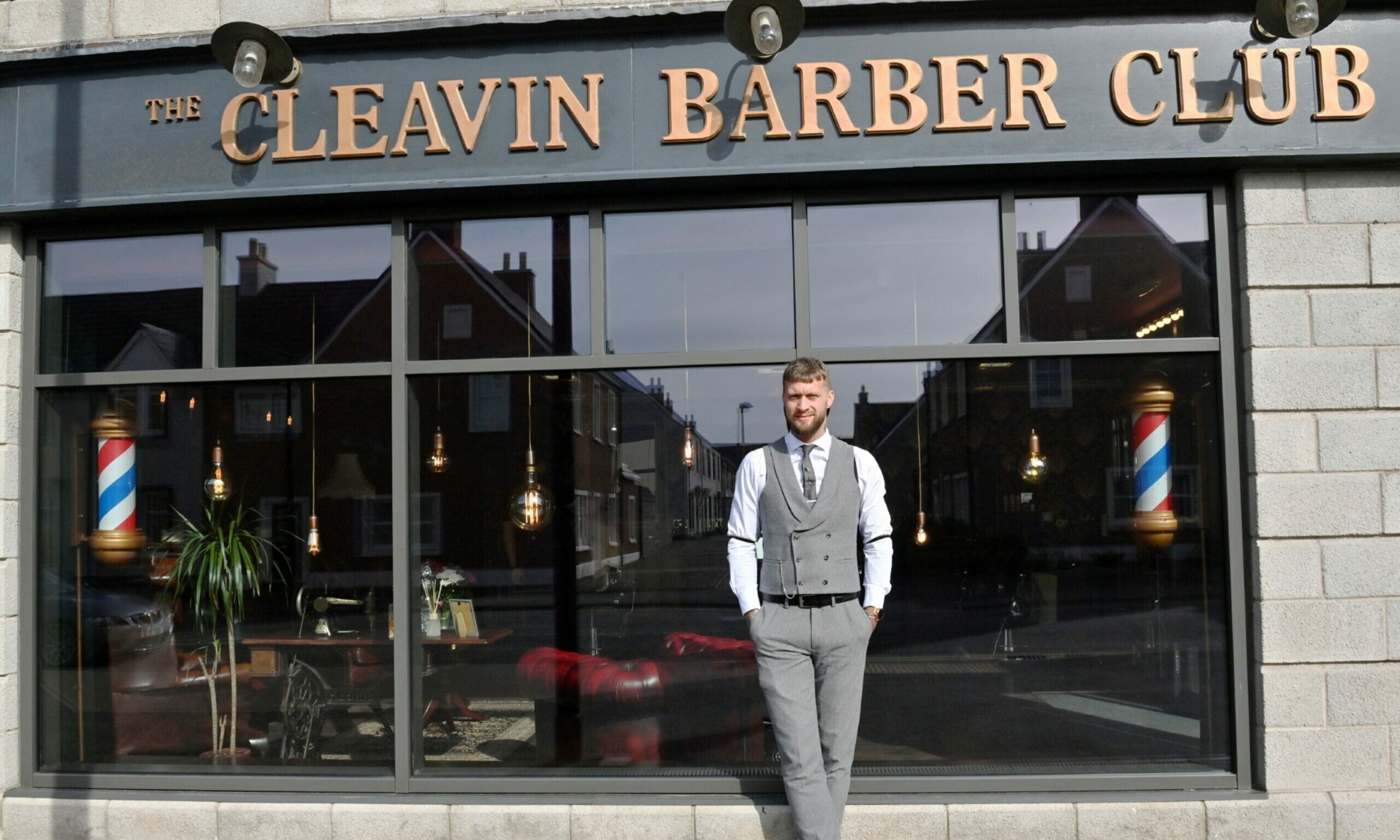 The Cleavin Barber Club founder Daniel outside his old Cove premises. 