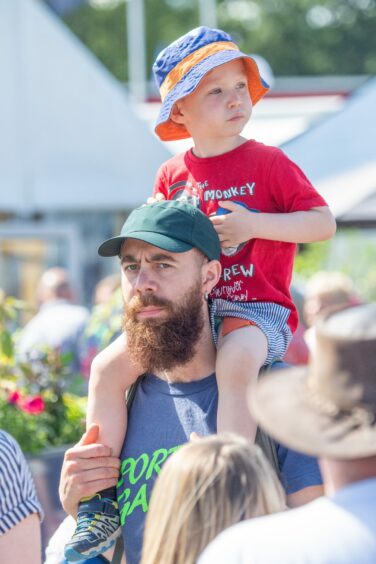 Man with boy on shoulders at the Turriff Show on Sunday.