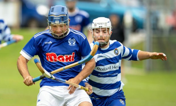 Kyles' Robbie MacLeod (left) with Iain Robinson (Newtonmore).  Image: Neil Paterson.