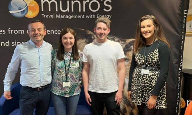 Munro's Travel managing director Murray Burnett, and training academy graduates Annabel McColl, Marc Taylor and Rebecca Thomson.