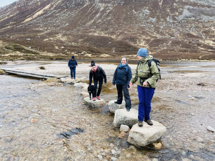 Gillian hiking with her clients.