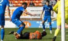 Peterhead defender Ryan Strachan pictured after a foul on Dundee United's Mathew Cudjoe inside the box.