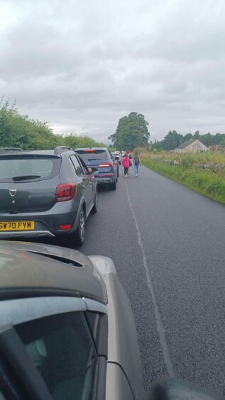 Tailback towards Belladrum Estate for the festival, with attendees abandoning cars to walk.