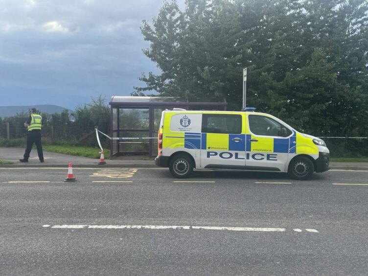 Police at the scene of the Culloden bus stop death