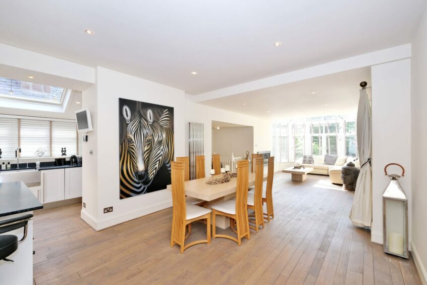 Minimalist open plan kitchen, dining and family area in the Aberdeen west end house.